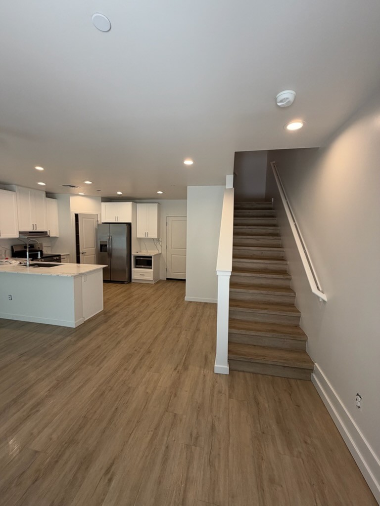 Apartment stairwell and living area walls painted by Grand Canyon Painting and Drywall